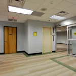 Secure entrance hallway with automatic doors built by CCG, commercial construction company Atlanta, featuring modern healthcare facility design